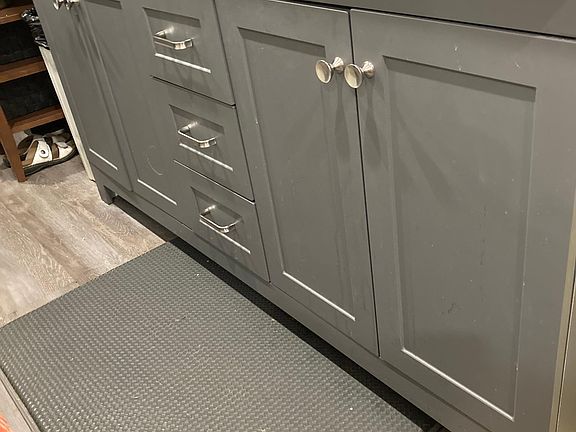 Kitchen cabinet with pans, silverware etc