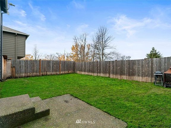 This yard has lots of room for pets and for play.