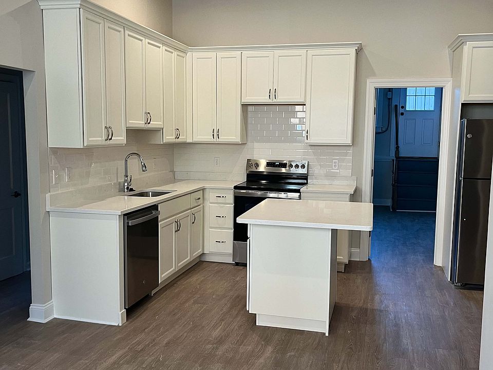 Newly renovated kitchen features brand new appliances: dishwasher, electric range and garbage disposal.
