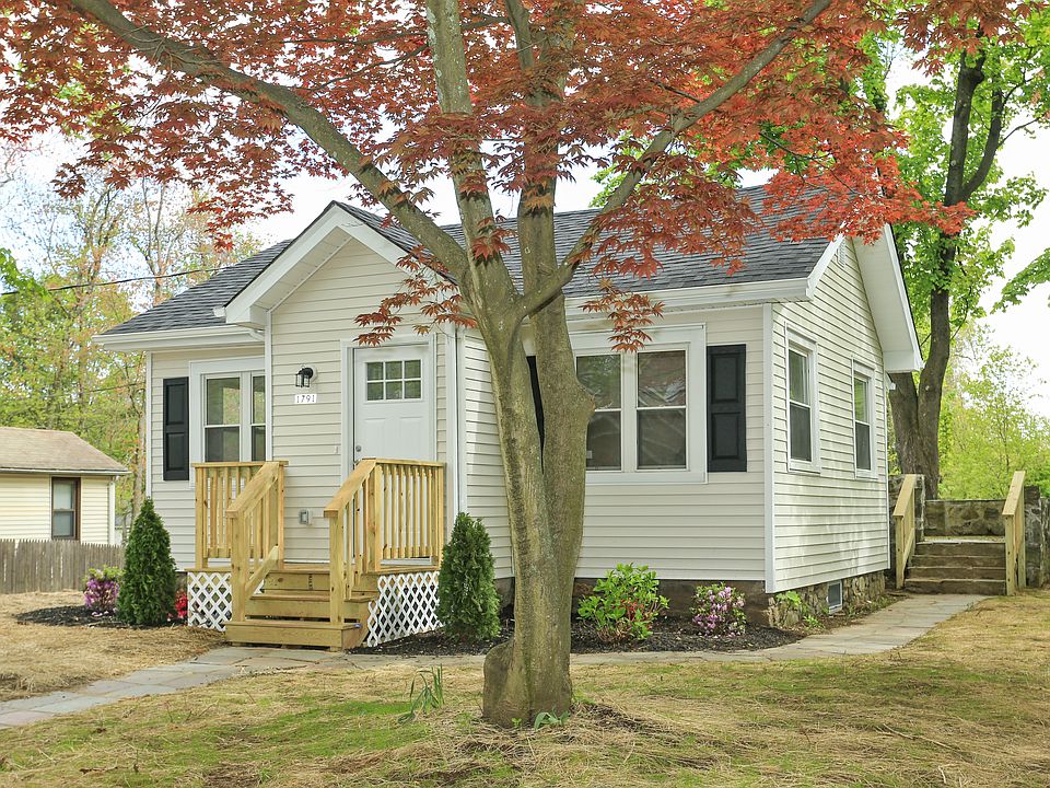 Front Of House With New Siding & New Plantings
