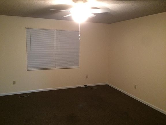 Living Room. Front door to the left. Hallway to the left. Kitchen to the right.