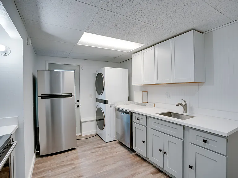 Fully equipped kitchen with in-unit washing and drying machines