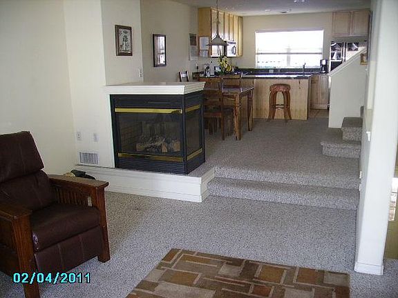 Long view from the living room to the dining room to the kitchen.