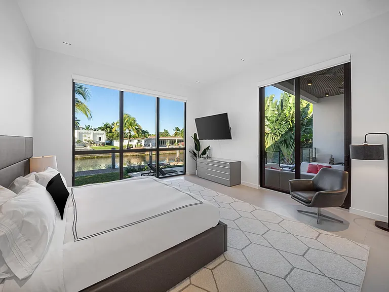 Our primary bedroom features a spacious room for you to relax and lounge in. And the view is just, amazing!