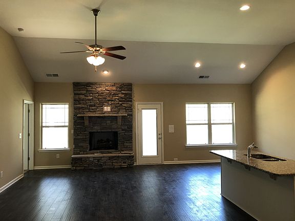 File photo of the great room with stacked stone gas fireplace.