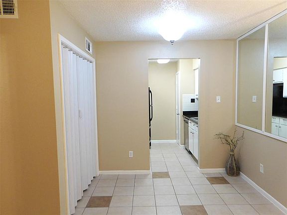 Dining area with enclosed laundry room to the left.