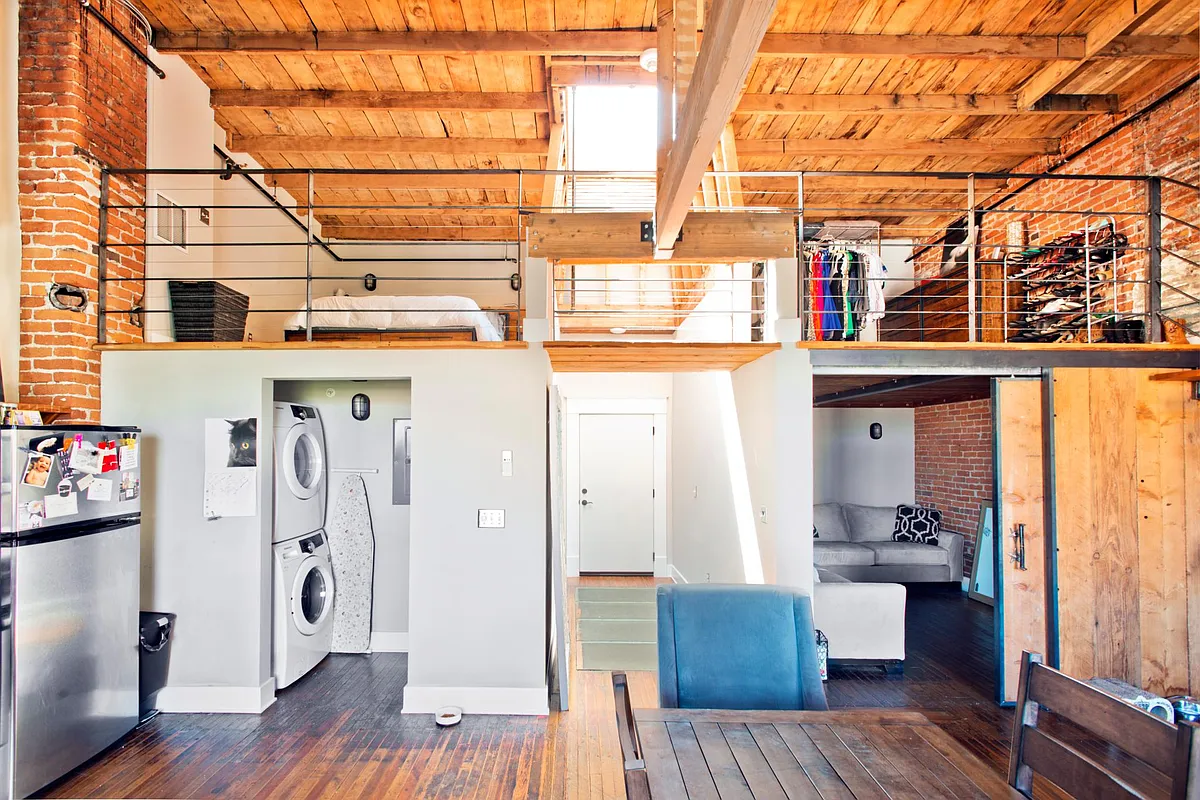 Laundry, entry way and downstairs room. - 225 W Riverside Ave