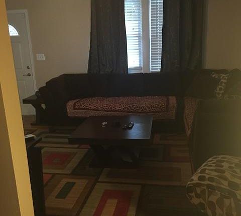 Living Room with ceiling fan and plenty of natural light.