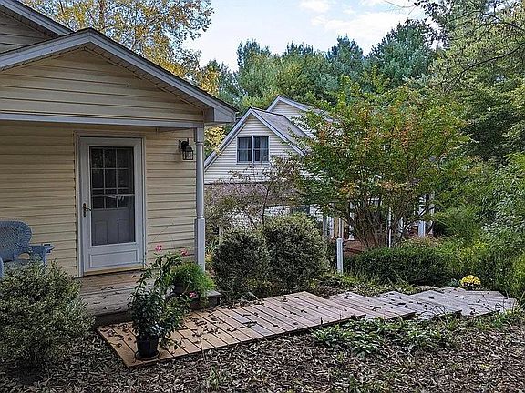 Apartment entrance door. Our house is in the background.