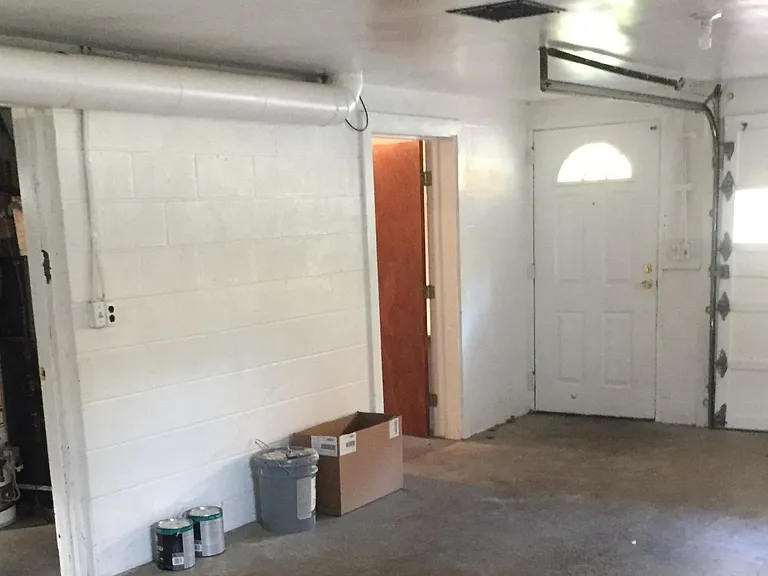 Garage with entries from laundry area and possible 3rd bedroom/storage area.