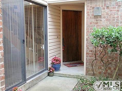 Covered front porch. Dining room has sliding glass door opening