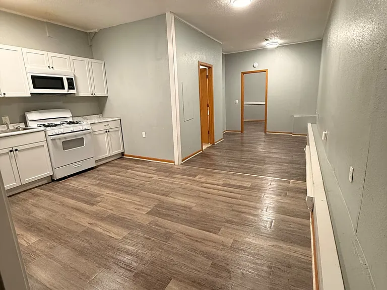 Kitchen to bedroom entry, bathroom on the side