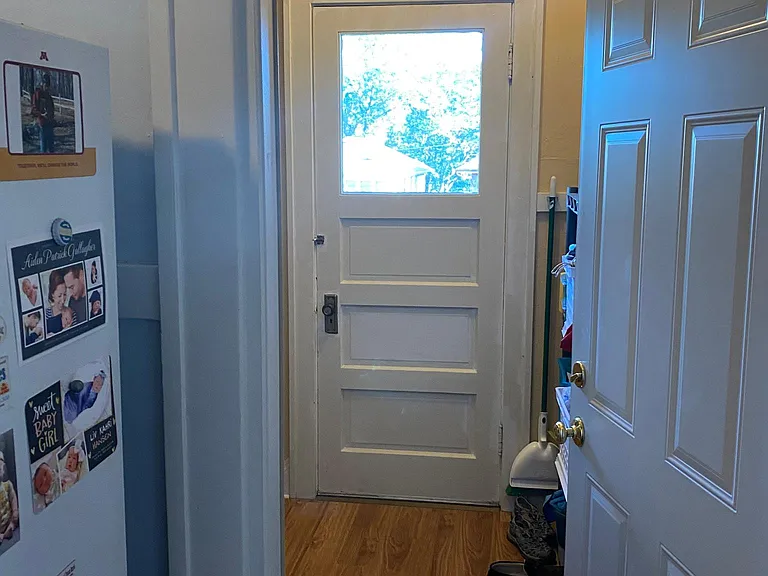 Out the back door/back entry way. Door goes out to private porch.