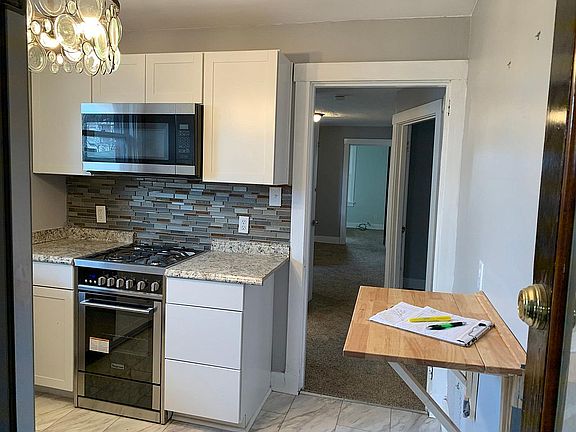 new Gas convection oven, new microwave and glass backsplash.