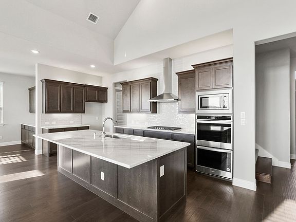 Kitchen in the Eliot home plan by Trophy Signature Homes