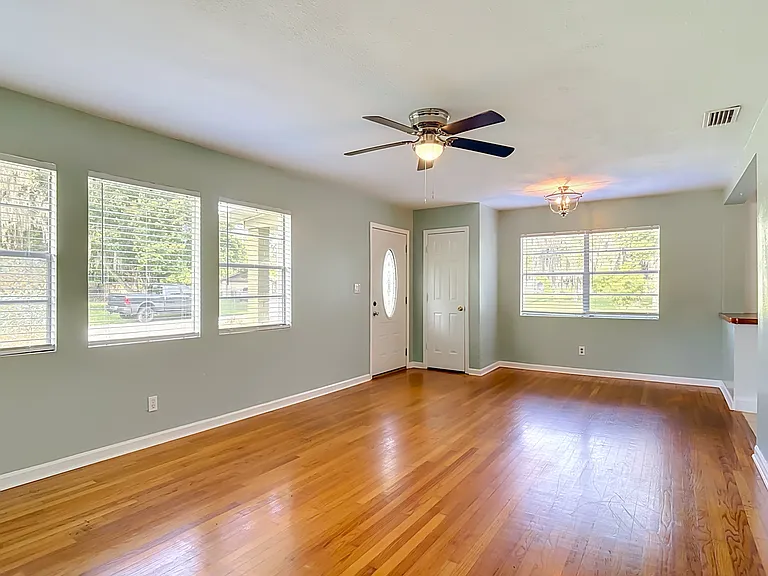 Living area facing front door and mud closet