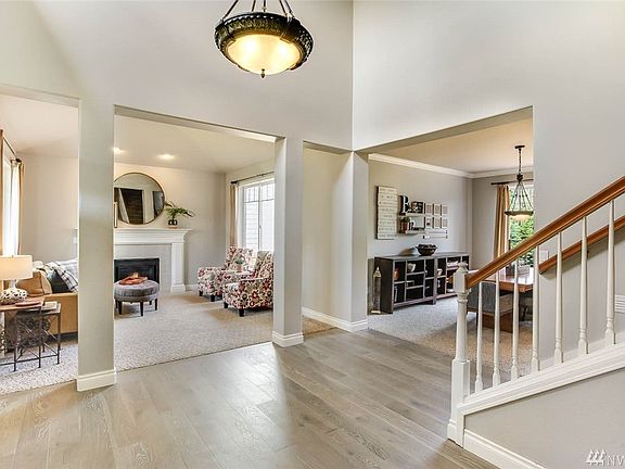 Enter to soaring ceilings and gleaming, brand new engineered hardwood floors. Handsome columns mark the entry to the living room.