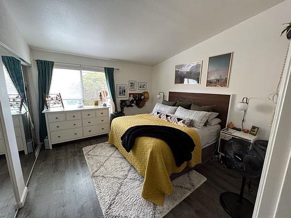 Master Bedroom with king bed from entry door overlooks private patio yard