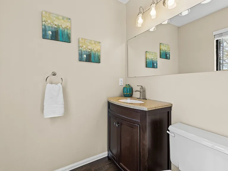 Convenient main-level half bathroom for guests.