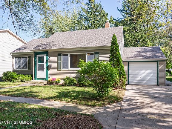 This picture shows both the front and the garage and the parking pad that will park 2 cars!