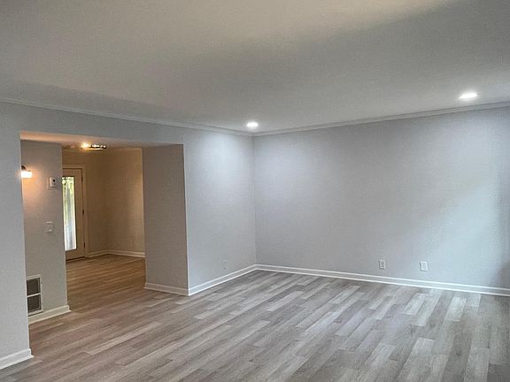Family Room Whole House Newly Renovated Fresh Paint and Flooring Throughout New Light Fixtures