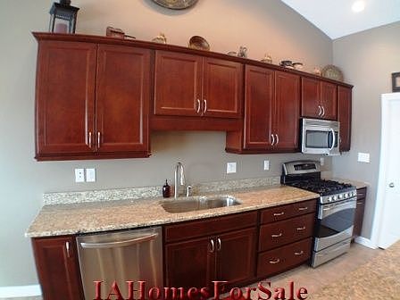 Kitchen: 5-burner gas stove with a double oven.  Dishwasher has child safe controls.  Kitchen sink is one tub and extra deep for easy dishwashing.  Deep and self-closing drawers.Electrical outlet above kitchen cabinets to light christmas decorations, etc.