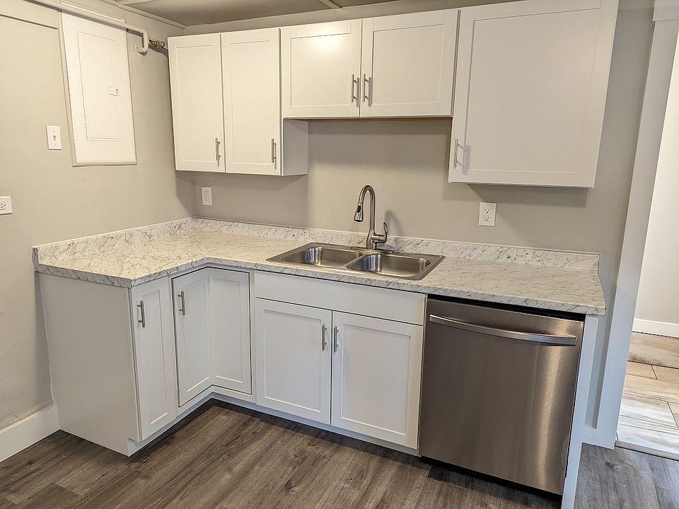 Brand new kitchen. There will be a stainless steel oven range and fridge to the left of the corner cabinet.