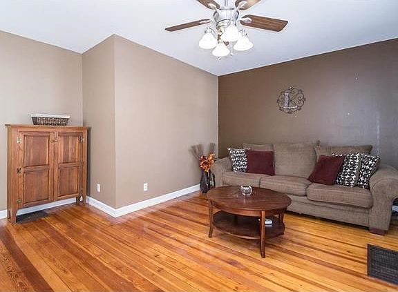Cozy Living Room with hardwood floors.