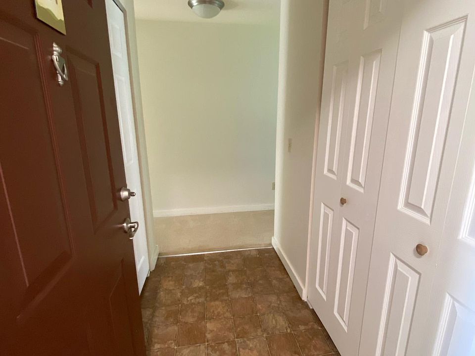 Foyer with coat closet on the right and laundry closet on the left. Full size washer and dryer included.