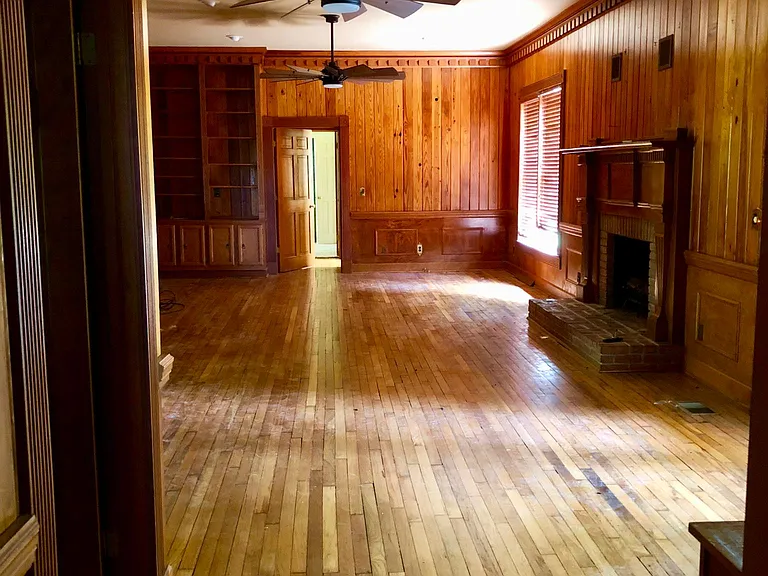 Beautiful wooden den, large ceiling fans. Door opens to walk-in- wet bar. Door opens to office/5th bedroom. French doors open on to deck. Door opens to foyer. Door opens to kitchen.
