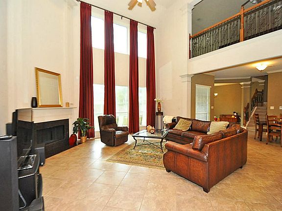 Wrought iron stair case over looking the family room!