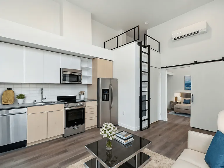 Modern living area with a kitchen and loft at Alt Capitol Hill.