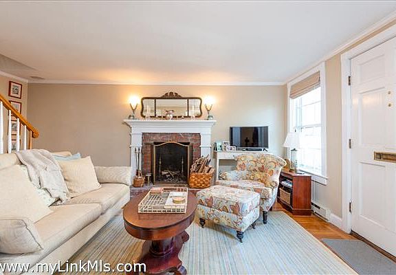 Living room with wood burning fireplace