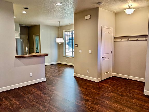 Entry with front closet and coat rack