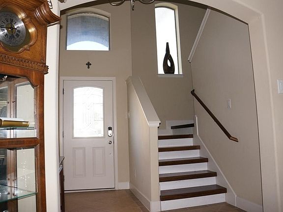 2 story foyer.  Lead glass front door. Engineered hard wood floors throughout.  Tile in wet areas