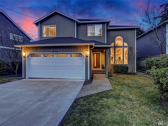 This exquisite home sits high on a quiet street in front of Seattle's most sought after neighborhoods, Discovery Park