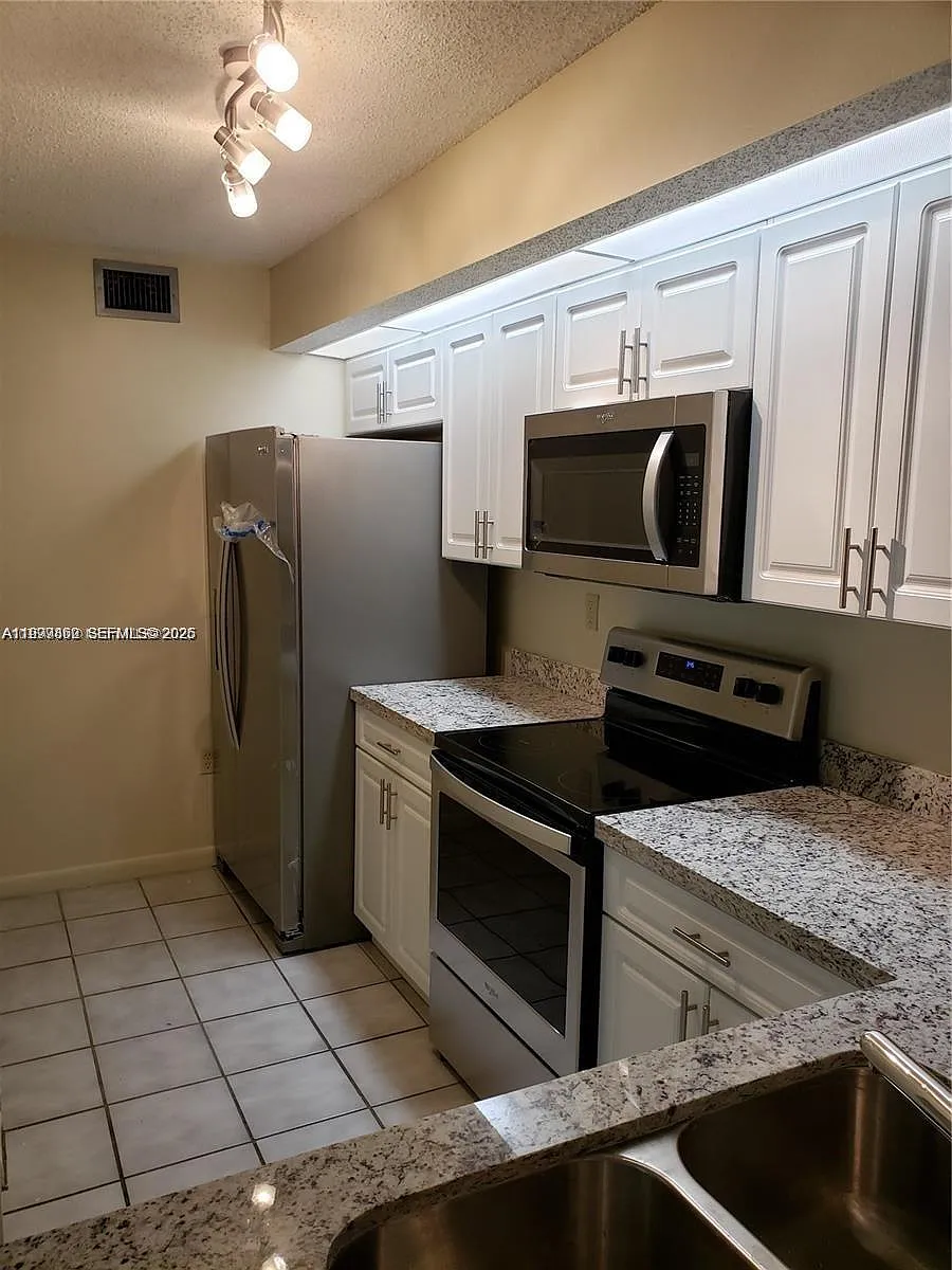 Building Photo - 8590 SW 212th St #203