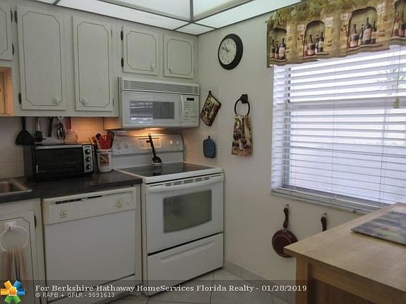 KITCHEN VIEW -WINDOW OUT THE FRONT-ROOM FOR A SMALL TABLE & CHAIRS-