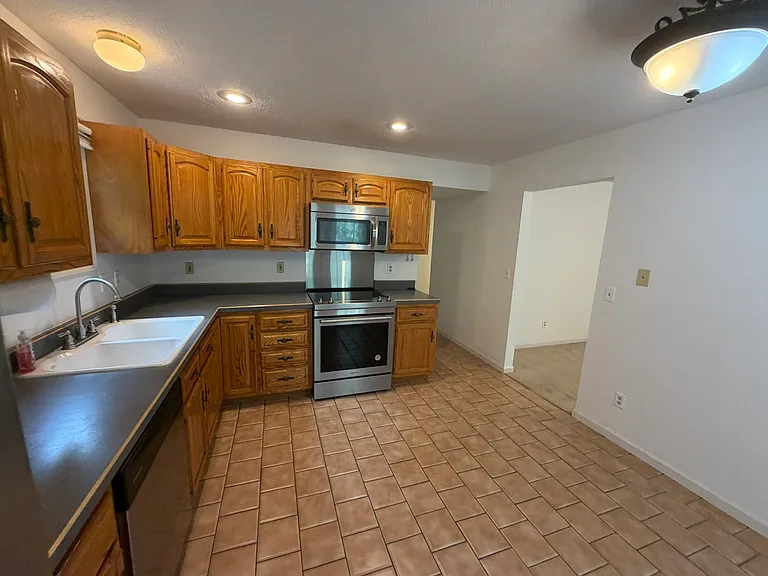 Kitchen and hallway to laundry and garage