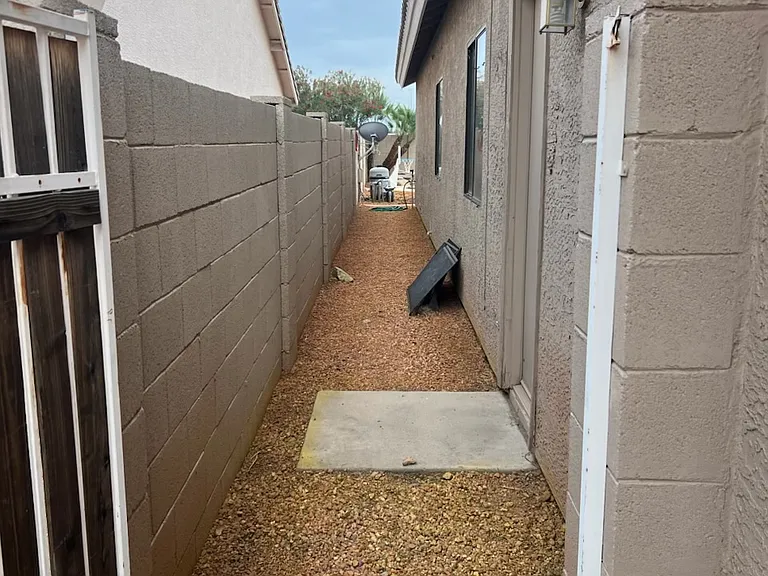 side of home prior to exterior painting