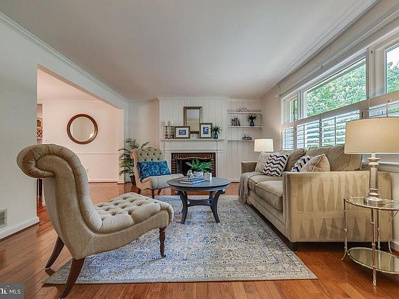 Formal living room with wood burning fireplace
