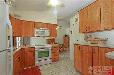 Bright, fresh kitchen with lots of storage.