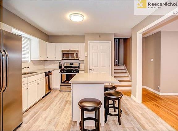 KITCHEN WITH NEW FLOORING, ISLAND & APPLIANCES