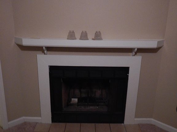 Fireplace with mantle just right for hanging stocking at Christmas time