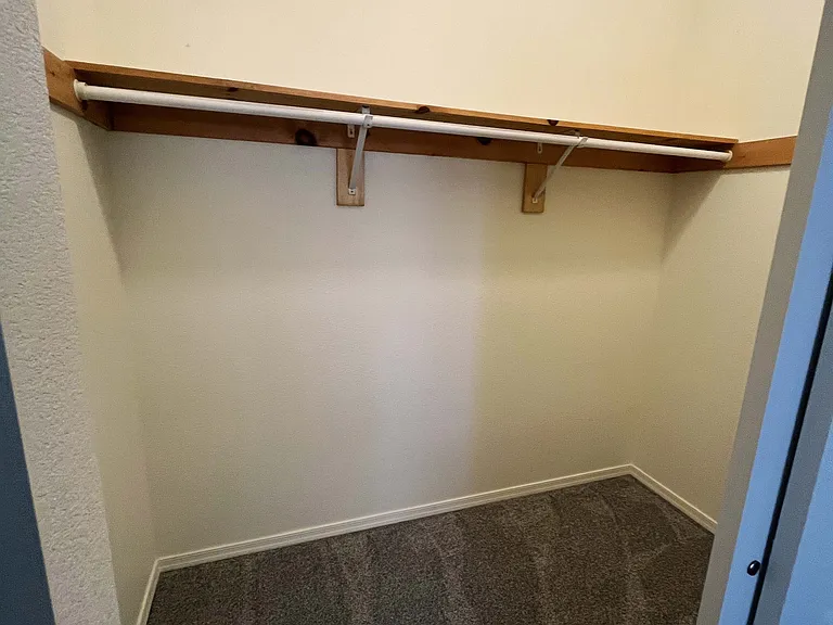 large closet with sliding door