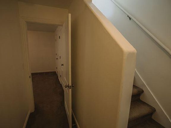 Stairwell to downstairs and entry of basement bedroom