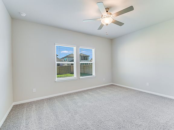 Have plenty of room in this spacious primary bedroom.