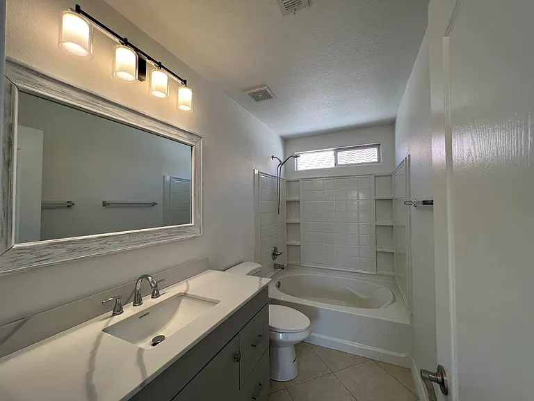 Upstairs full bath with new vanity and fixtures.