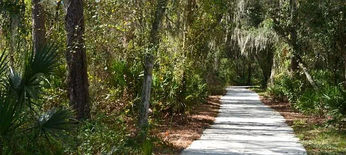 Walking distance to the 55-acre wooded Conservatory Park, which has a picnic pavilion with restrooms. A nature and paved loop trail curve past an observation deck on a 10-acre lake.