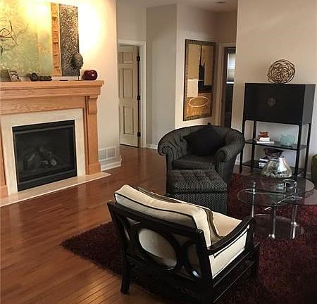 First floor living room with gas fireplace.  Guest bathroom around the corner.